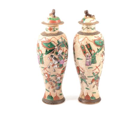 A pair of Satsuma pottery covered vases, warriors in a mountainous landscape against a craquelure ground, 36cm.Condition repo