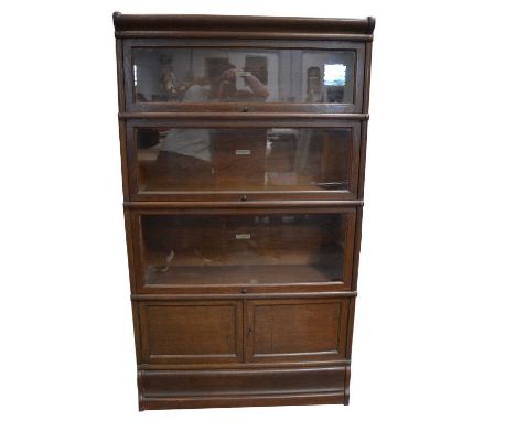 Oak four-height sectional bookcase, labelled Globe Wernicke, including three glazed sections and one with cupboard doors, wid