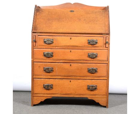 Edwardian light oak bureau, the top with three quarter gallery, fall front above four long graduating drawers, bracket feet, 