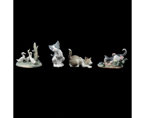 Lladro and Nao; various models including a panther on globe (matt glaze), a reclining donkey, three cats, three Nao duck figu