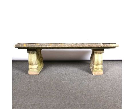 Haddonstone garden bench, rectangular top with later ceramic tile, two scrolled supports, 130x41cm, height 45cm.