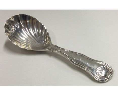 A heavy George III silver caddy spoon with fluted bowl. London 1816. By William Eley. Approx. 28 grams. Est. £50 - £80.