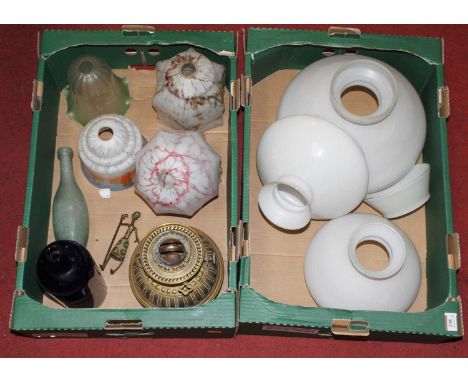 Two boxes to include a Victorian brass oil lamp and various light shades 