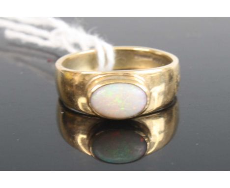 A 9ct gold opal set band ring, 4.3g, size P/Q