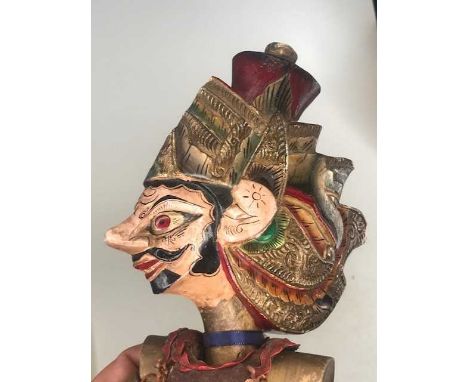 A hand carved and polychrome painted wooden puppet, probably North African ; together with two paper puppetsCondition – small