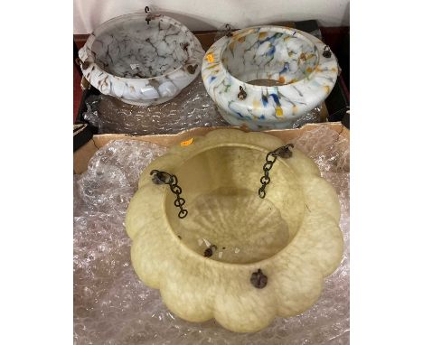 Three 1930s opalescent marbled glass ceiling light pendantsOne shade irreparibly damaged during the viewing (now removed from