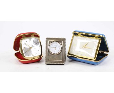 A modern silver clad easel clock by Arthur Price of England, having a circular dial with Roman  numerals and quartz movement,