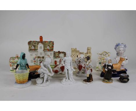A collection of Victorian and later Staffordshire pottery, to include animal figures and architectural models 