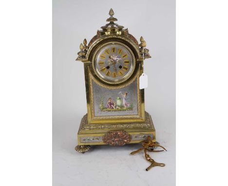 A Napoleon III style brass cased mantel clock, case surmounted by pineapple finial, the dial with Roman numerals and painted 