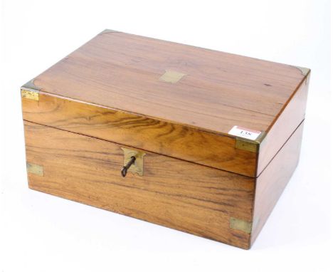 A Victorian walnut and brass bound writing slope, the lid lifting to reveal a gilt-tooled green leather lined writing surface