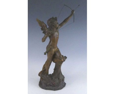 An Austrian pottery model of Cupid, early 20th century, shown leant on a stump with bow raised, impressed 'Made in Austria' t