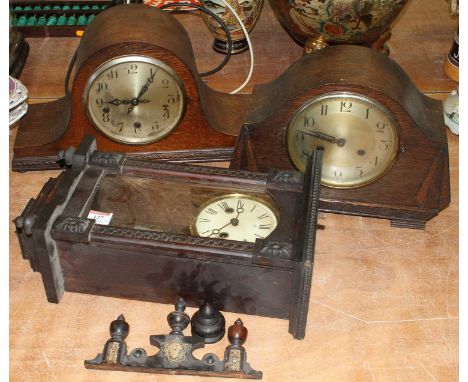 An early 20th century oak cased mantel clock, h.23cm; together with another similar example; and a wall clock (3)