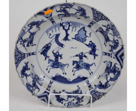 A Chinese blue and white porcelain dish, Kangxi period, decorated with warriors, six character Chenghua reign mark within dou