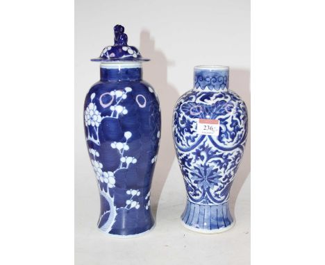 A Chinese porcelain vase and cover in the blue &amp; white Prunus pattern, the cover surmounted by a Dog of Fo, height 30cm, 