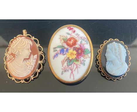 A carved shell cameo brooch 35x26mm in 9ct gold mount, together with one other smaller sample, again in 9ct gold mount, and a