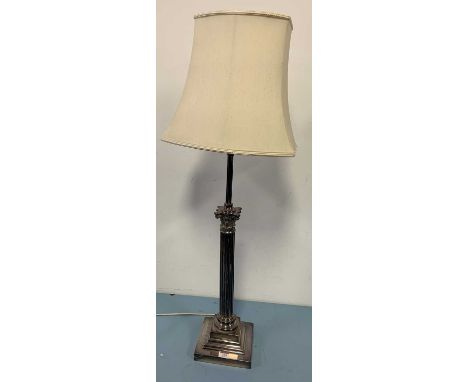 A plated metal table lamp in the form of a Corinthian column, h.26cm (including shade)