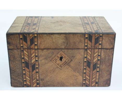 A Victorian burr walnut tea caddy with two bands of parquetry inlay, the hinged cover opening to reveal two lidded sections, 