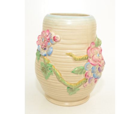 A Clarice Cliff vase, of bulbous form and decorated with floral sprays on a branch, height 21cm. 