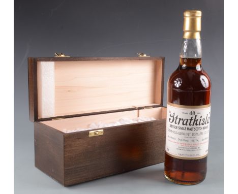 A bottle of 40 years old Strathisla Speyside Single Malt Scotch Whisky, 70cl, 40%, height 29.5cm, with a wooden box.
