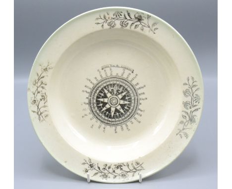 A maritime creamware dish, early 19th century, black transfer printed decorated to the centre with a compass and floral spray