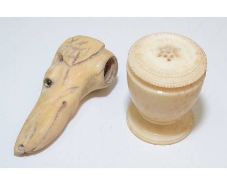 A 19th century bone stick finial in the form of a greyhounds head with glass eyes, together with an ivory 19th century pounce
