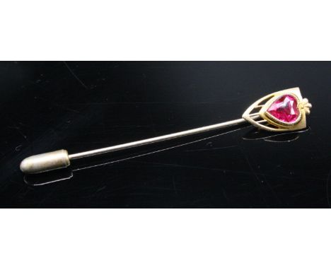 A 10ct gold stick pin set a heart shaped synthetic ruby.