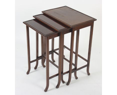 A nest of three mahogany tables, by Gillow of Lancaster, each impressed G.L and M to the underside, height of largest 68.5cm,