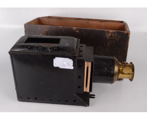 A Victorian brass and metal magic lantern, in a pine box, height 26cm, width 44cm, depth 16cm. 