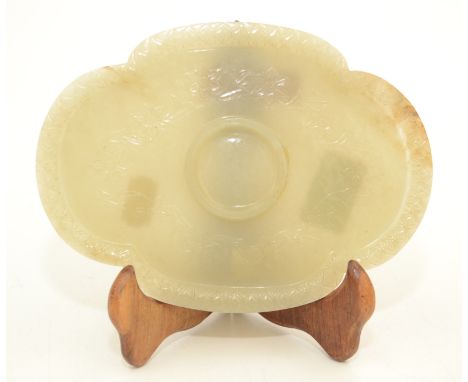 A Chinese celadon green jade Mogul style libation cup quatrefoil lobed saucer, 17th/18th century, the centre with a recessed 