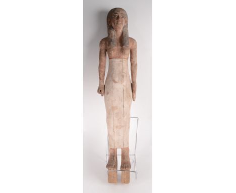 A carved wood and painted figure of a semi nude Egyptian lady, standing erect with her hands by her side, on a later wooden s