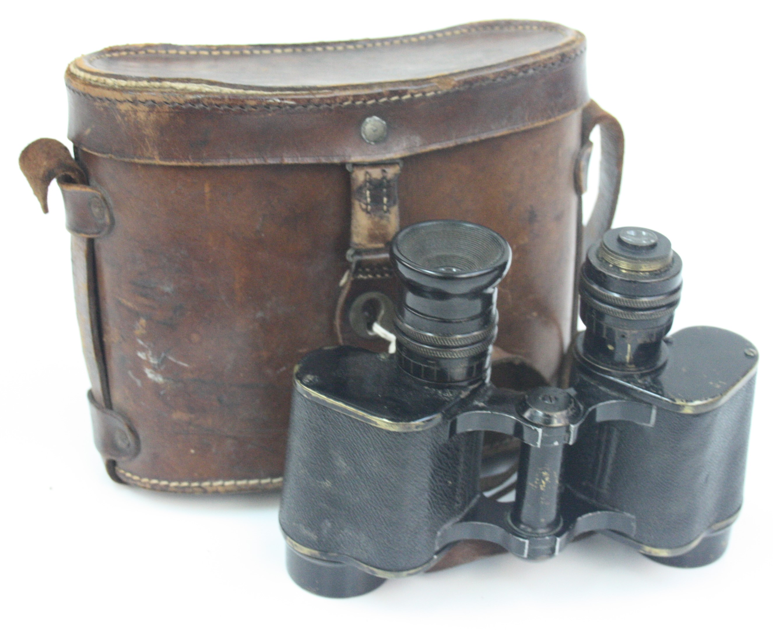 A pair of Hunsicker & Alexis, Paris military binoculars, in a brown