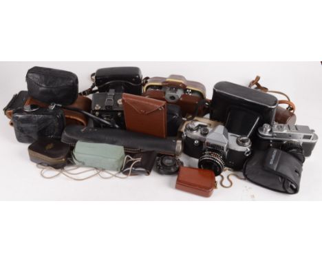 A Zenit-E camera, an Olympus PEN-EE, a Praktica PL nova IB, a Zeiss Ikon 8B Movinette cine camera and accessories, a Zorki-4 