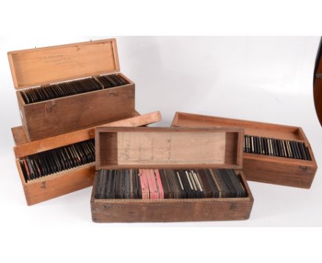 Four boxes of miscellaneous photographic magic lantern slides, including world images and a box of negatives.