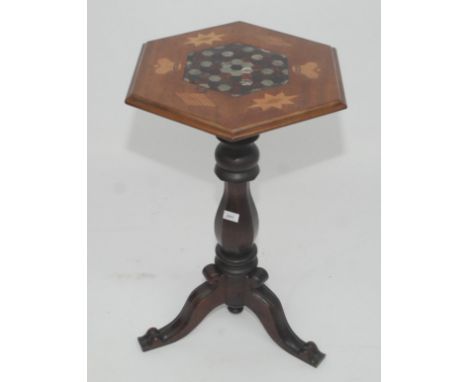 A Victorian mahogany tripod table, the inlaid octagonal top set with a central serpentine panel comprising of multiple sectio