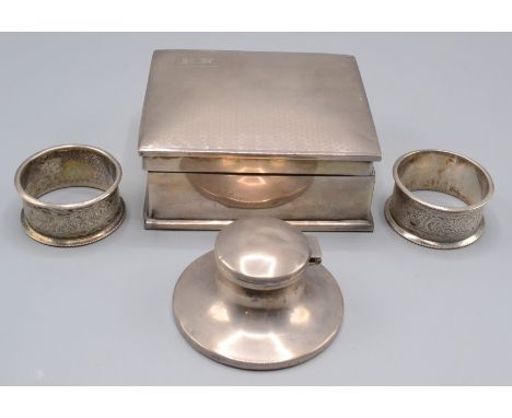 A Walker & Hall engine turned silver cigarette box, a capstan inkwell and a pair of silver napkin rings. 