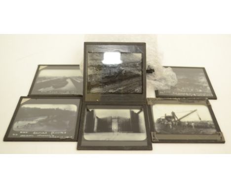 A collection of 12 magic lantern slides produced by Newton & Co depicting various stages of the construction of the Panama Ca