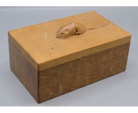 A Robert 'Mouseman' Thompson of Kilburn oak rectangular box, the cover with carved mouse signature, height 8cm, width 19cm, d