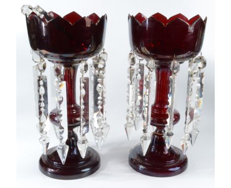 A pair of Victorian ruby glass lustres, height 34cm. Condition report: Condition report: wear to the gilt on the top rim. 