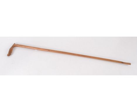 A carved hardwood walking cane, late 19th/early 20th century, possibly Russian, the finial carved with a horse's head above a