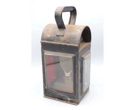 A black painted metal railway lantern, height 29.5cm.