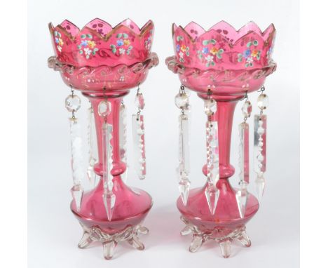 A pair of Victorian cranberry glass lustres, with gilt and painted enamel floral decoration, height 29.5cm. Condition report: