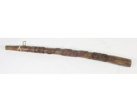 A wooden didgeridoo carved with a snake, length 131cm. 