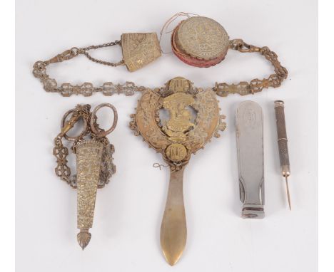 A brass chatelaine, a pipe smoker's knife and a silver toothpick.