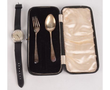 A gentleman's Cyma automatic nickel plated wristwatch and a child's silver spoon and fork. 