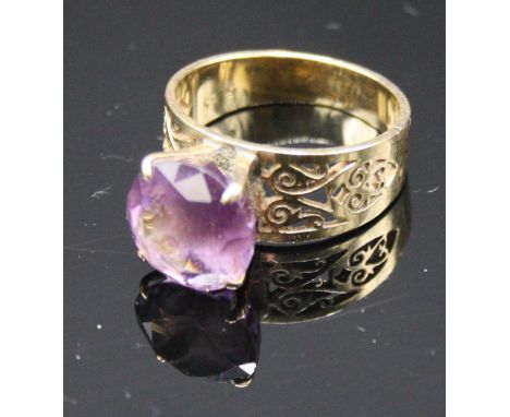 A 14ct gold amethyst dress ring.  Condition report: Stamped 585.  Size M.  Depth of sone mount 6mm. Dimension of stone 10mm s