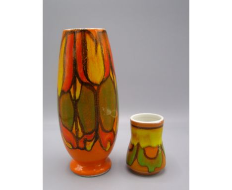 A Poole Pottery vase, the orange ground with a green and yellow abstract design, number 15 to the base, height 22cm and a sma