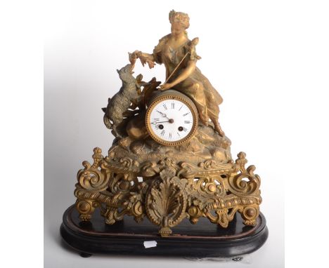 A French gilt metal mantel clock, 19th century, surmounted by a shepherdess and her sheep, on an oval plinth, height of clock