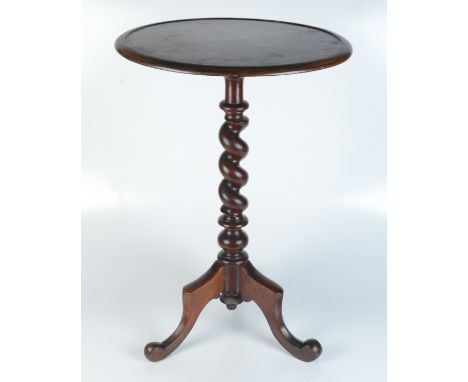 A Victorian mahogany tripod table, the circular top on a barley twist stem and downswept supports, height 71cm, diameter of t
