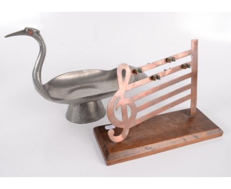 A pewter pipe rest in the form of a duck with hardstone eyes, height 24cm, length 32.5cm, width 15.5cm and a copper rack in t