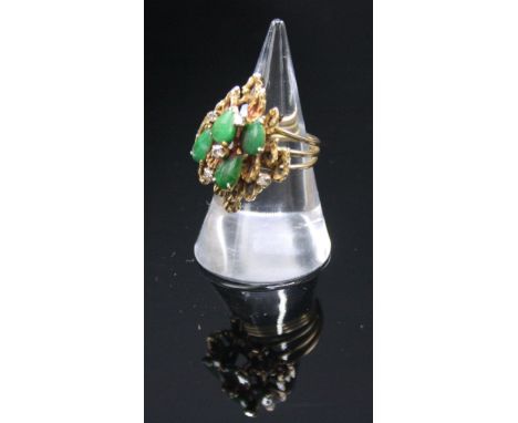 A 14ct gold jade and diamond dress ring.